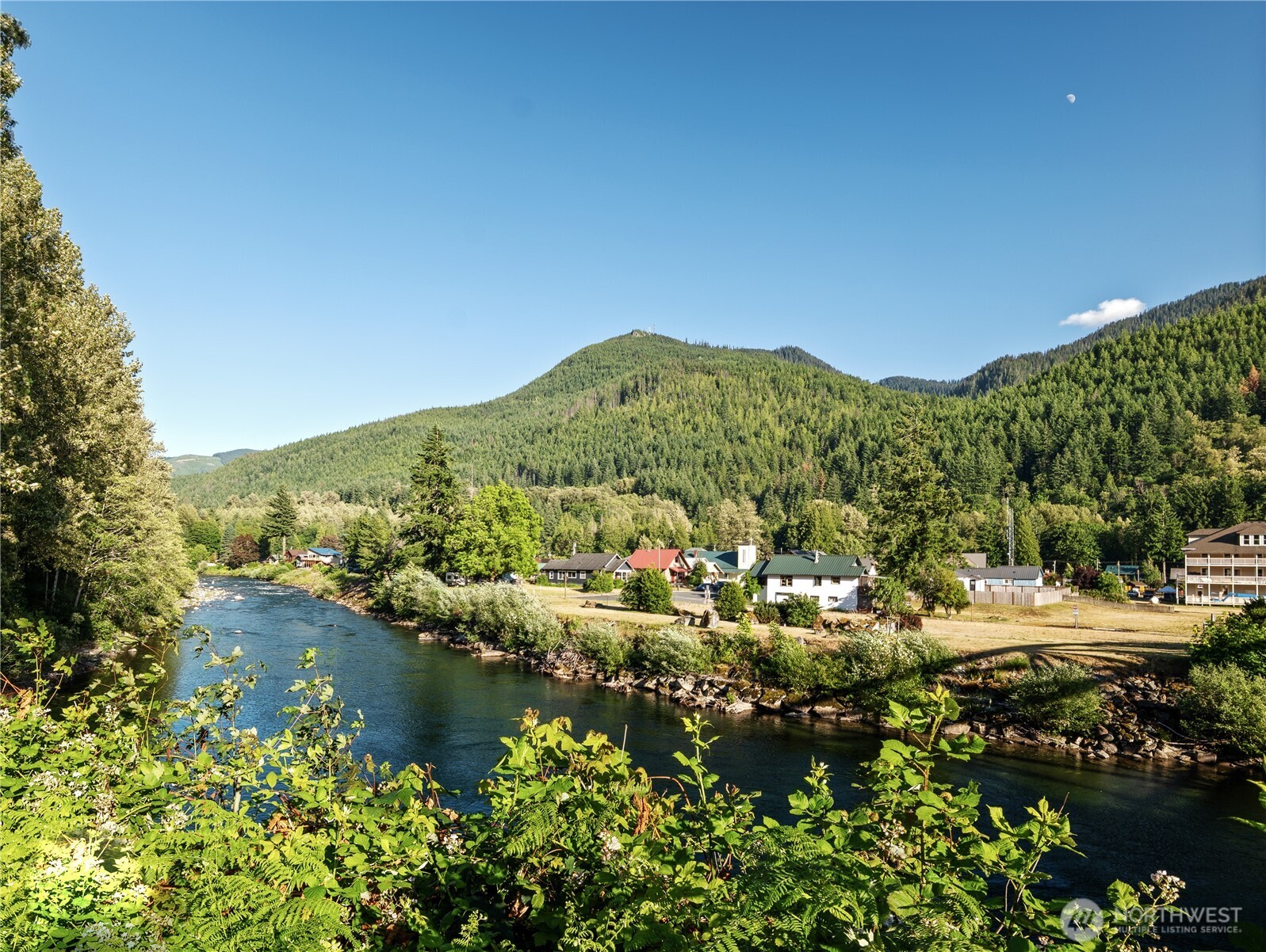 76011 Northeast 123rd Street Skykomish, WA 98288 - Photo 20 of 29 a view of a town with mountains in the background