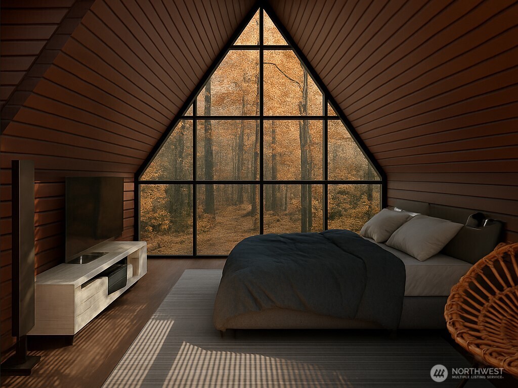 76011 Northeast 123rd Street Skykomish, WA 98288 - Photo 25 of 29 a living room with furniture a flat screen tv and a large window