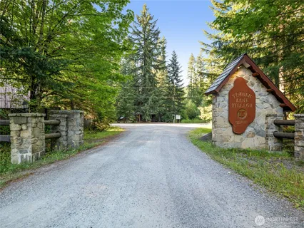 a view of beach and small yard