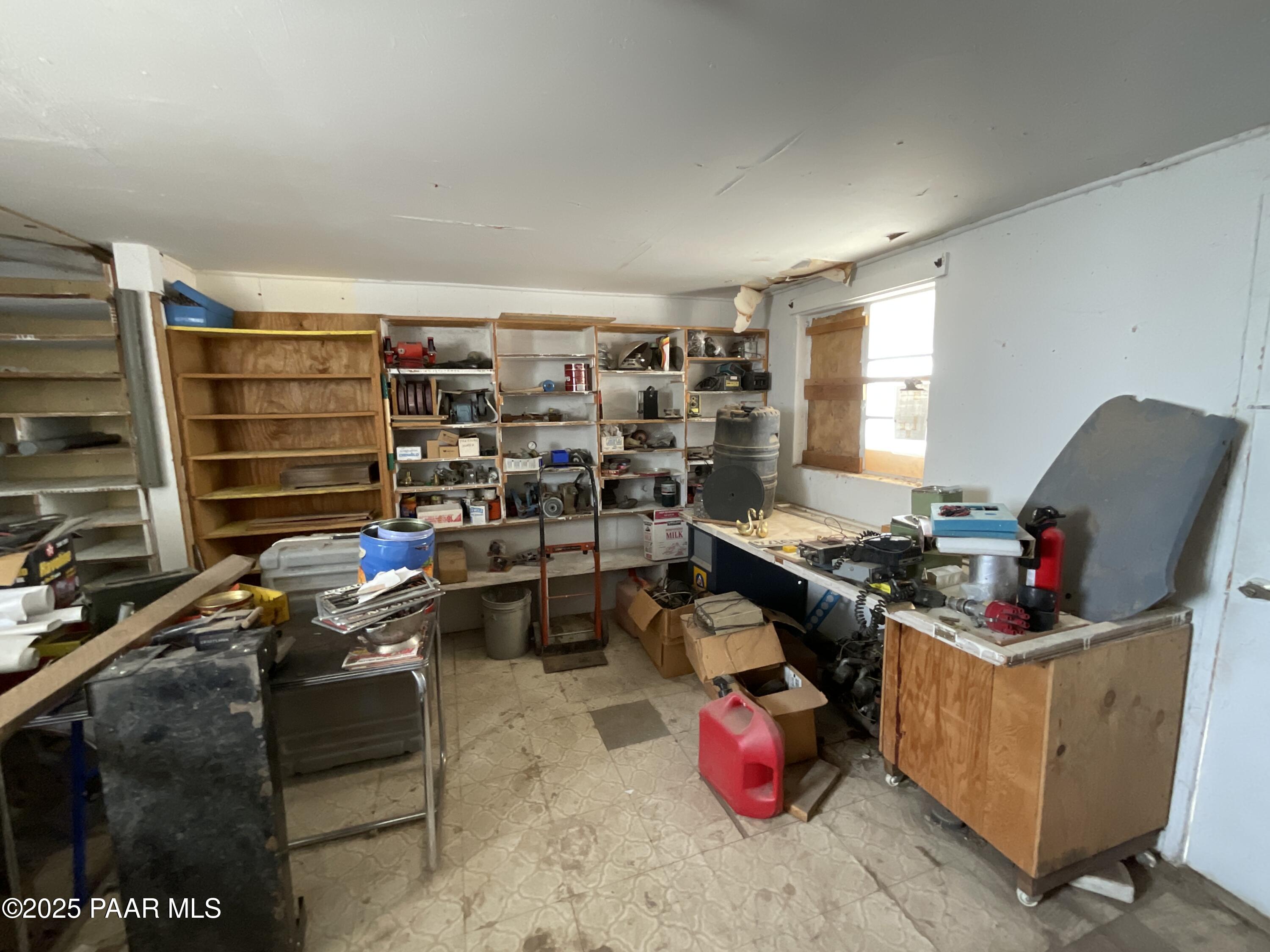 54251 3rd Street Seligman, AZ 86337 - Photo 12 of 15 a room with furniture a rug and gym equipment