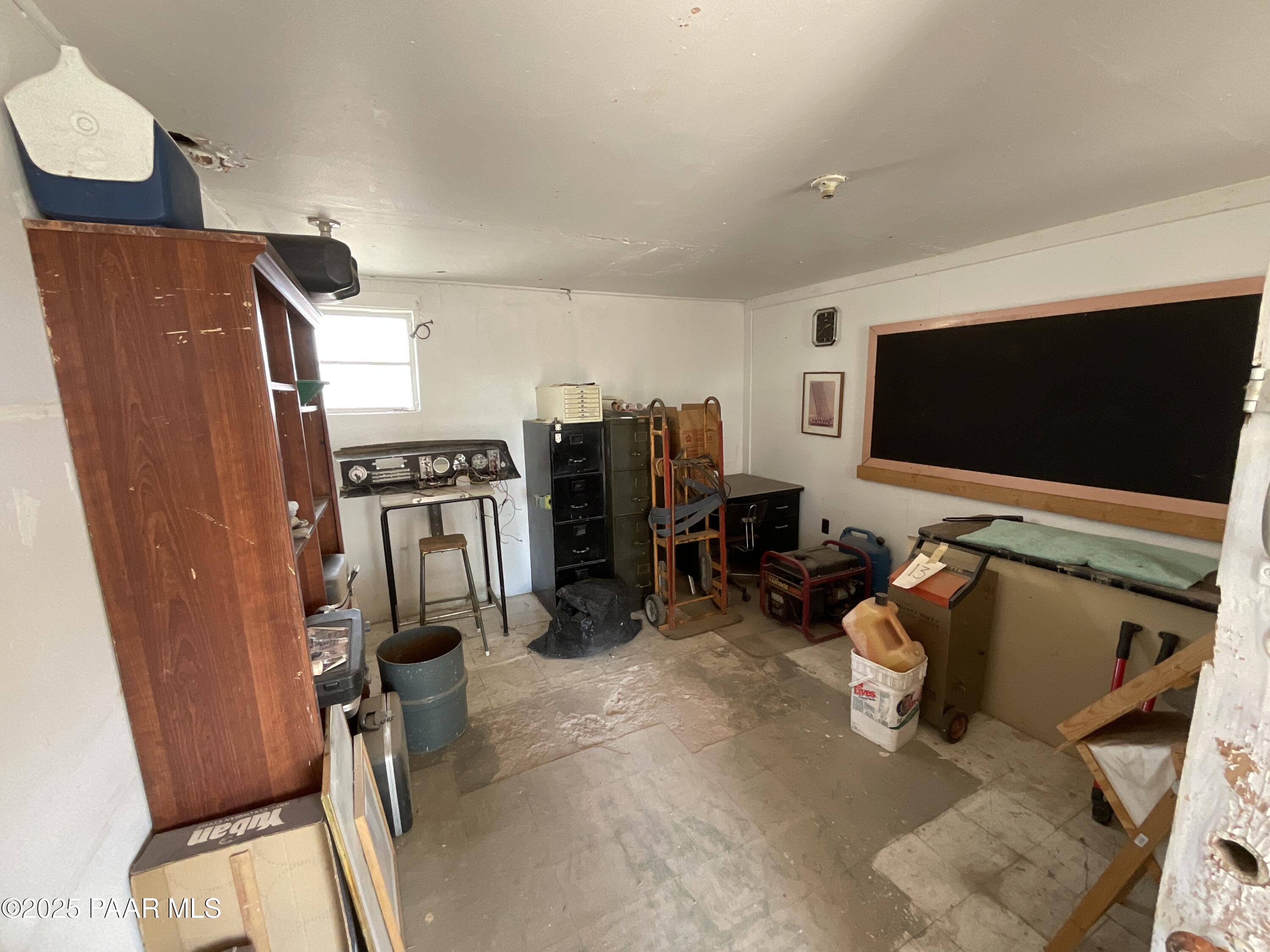 54251 3rd Street Seligman, AZ 86337 - Photo 3 of 15 a view of a room with gym equipment and a flat screen tv
