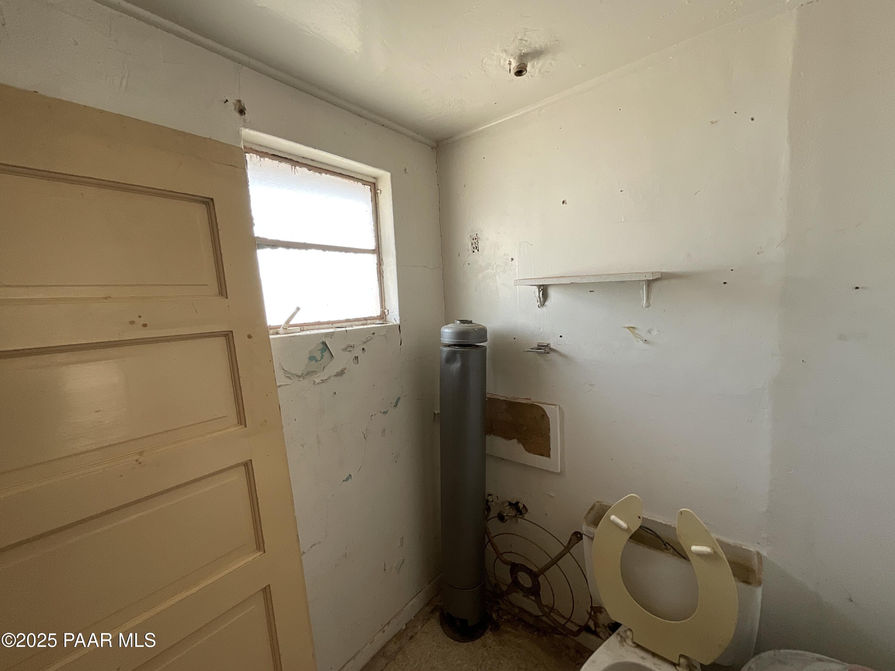 54251 3rd Street Seligman, AZ 86337 - Photo 6 of 15 a bathroom with a toilet and a sink