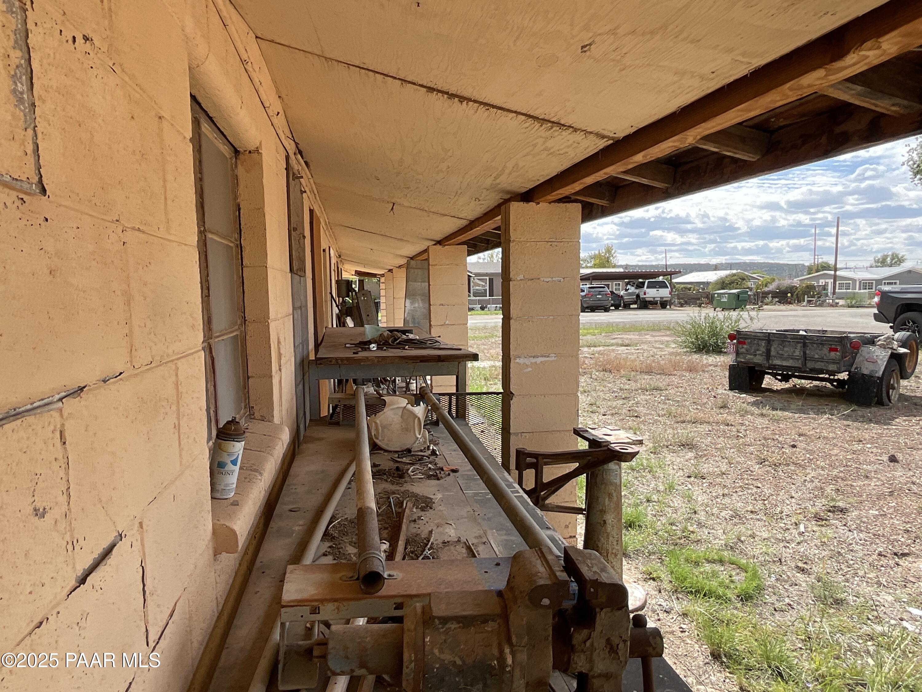 54251 3rd Street Seligman, AZ 86337 - Photo 8 of 15 a view of a balcony with furniture and wooden floor