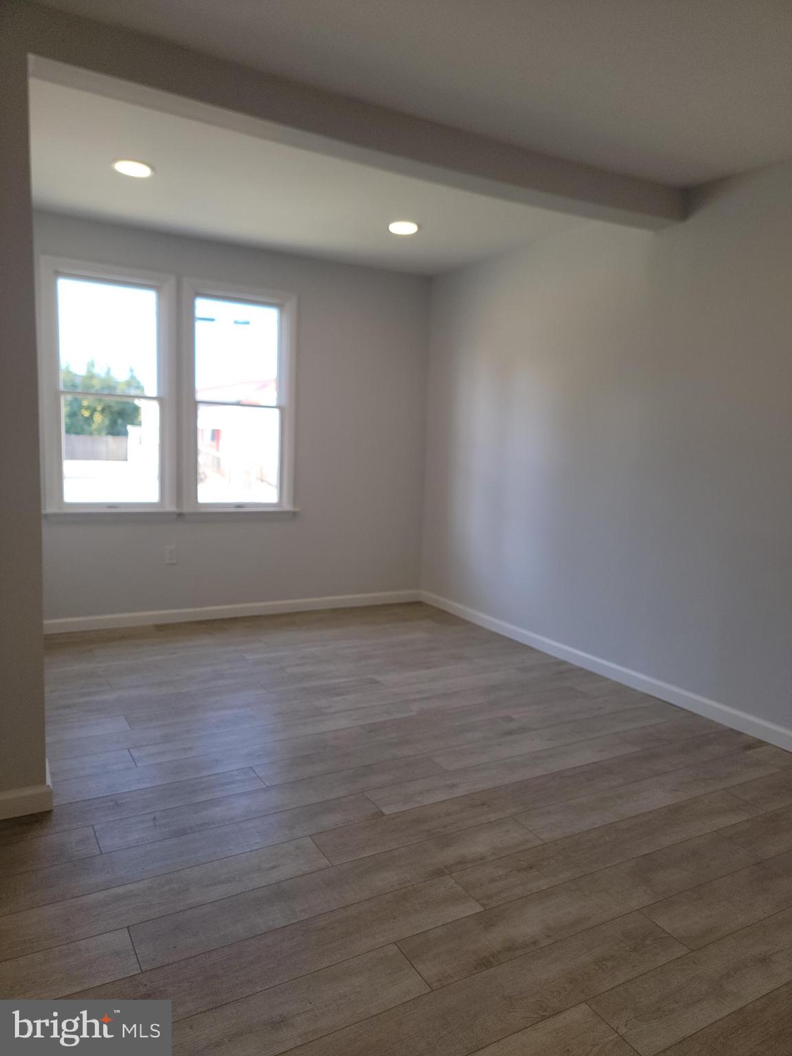 2621 North Snyder Avenue Sparrows Point, MD 21219 - Photo 16 of 65 an empty room with wooden floor and windows