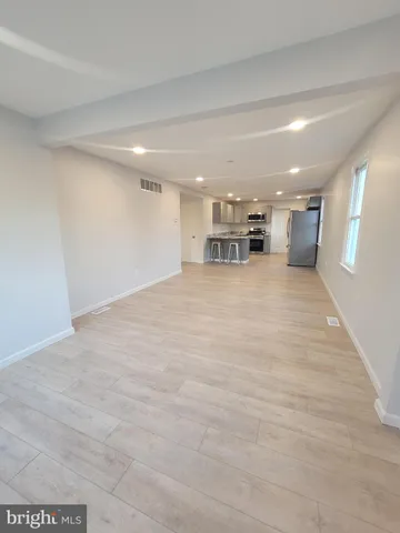 a view of a livingroom and a kitchen