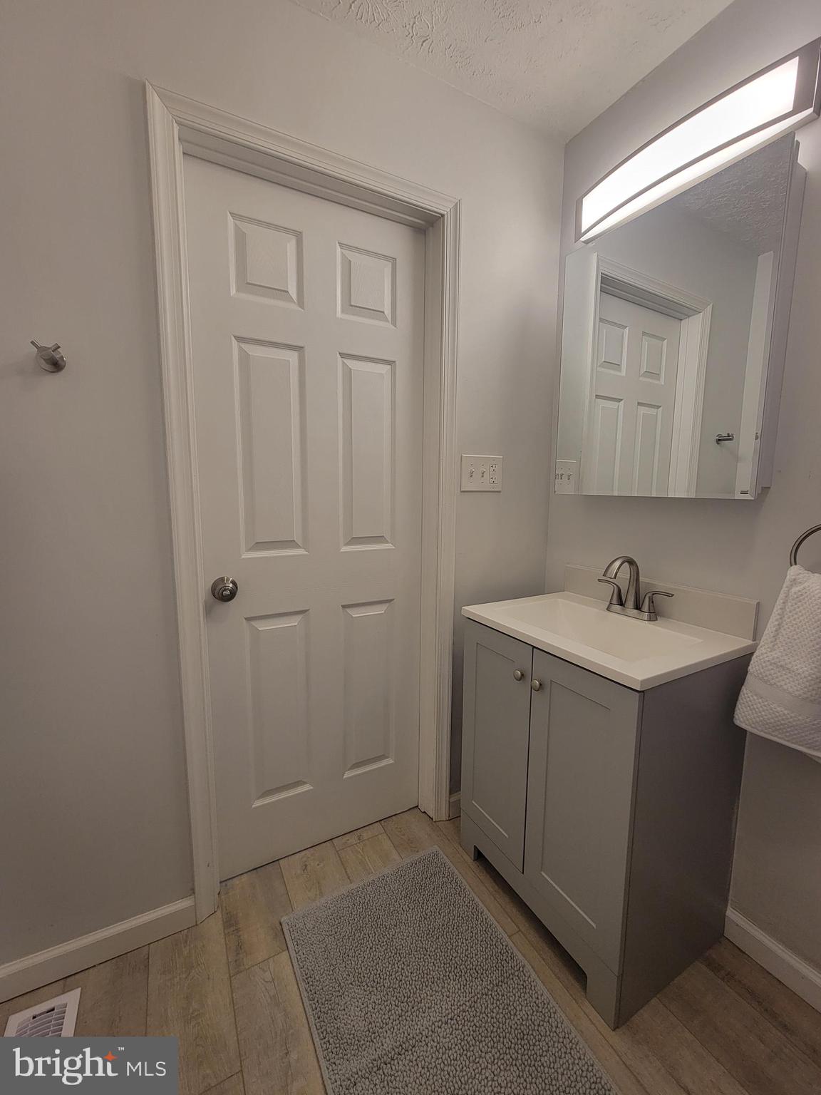 2621 North Snyder Avenue Sparrows Point, MD 21219 - Photo 21 of 65 a bathroom with a sink and a mirror