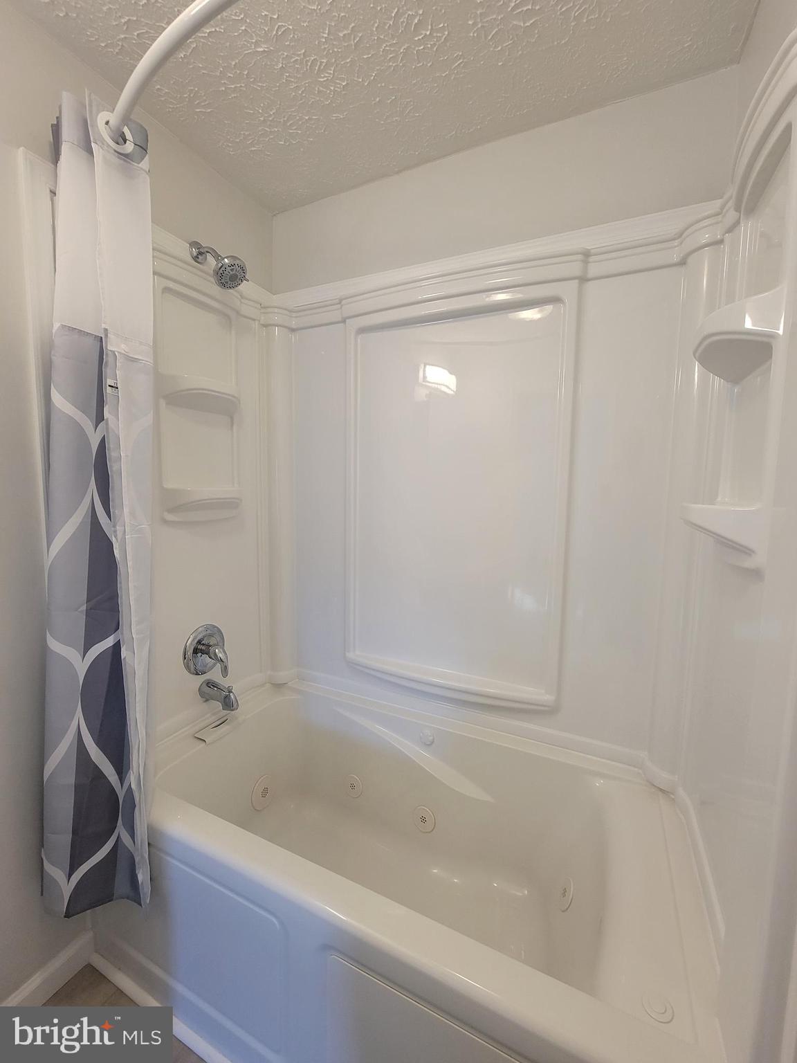 2621 North Snyder Avenue Sparrows Point, MD 21219 - Photo 22 of 65 a bathroom with a tub shower vanity and a shower