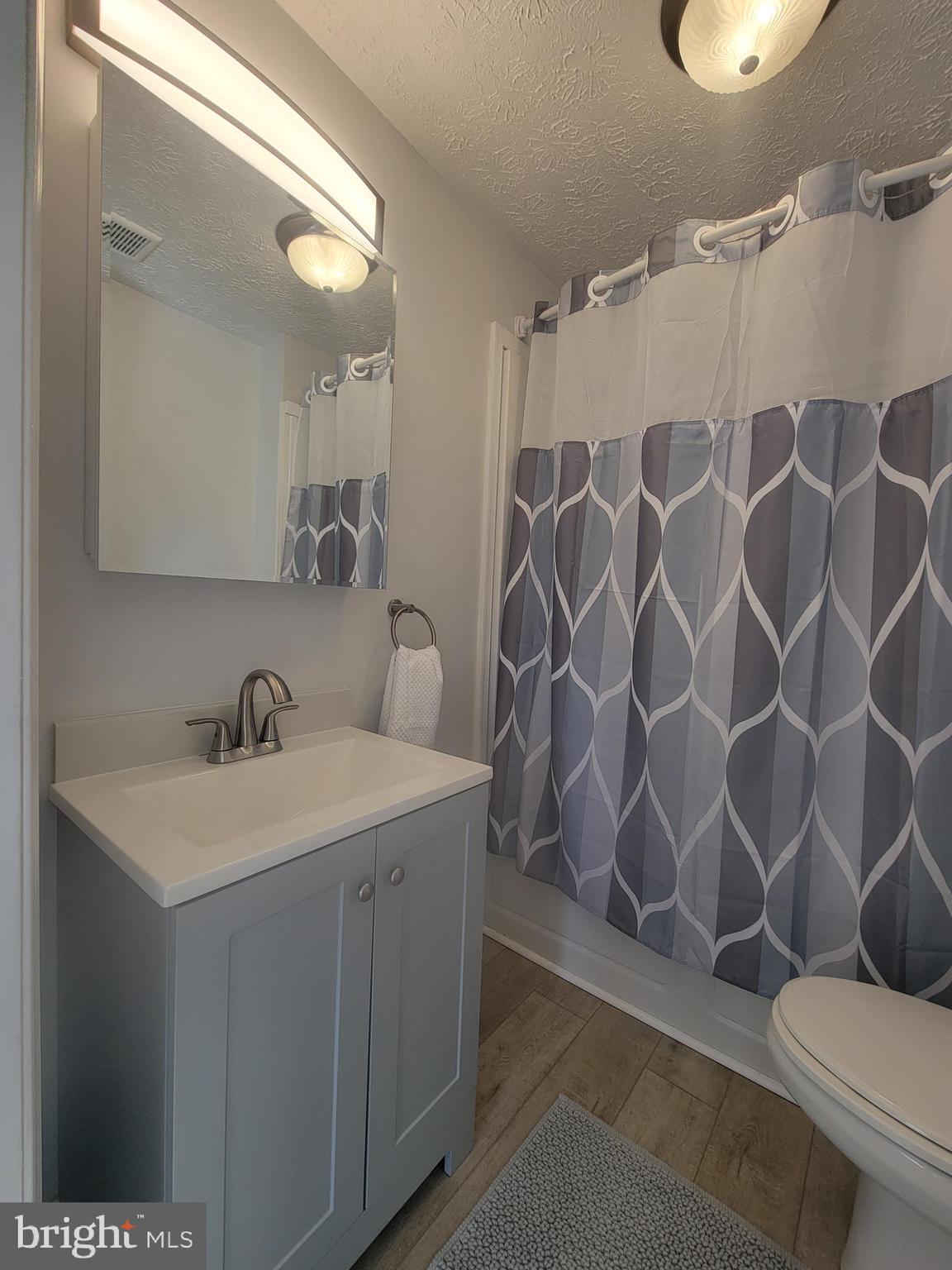 2621 North Snyder Avenue Sparrows Point, MD 21219 - Photo 23 of 65 a bathroom with a sink and a mirror
