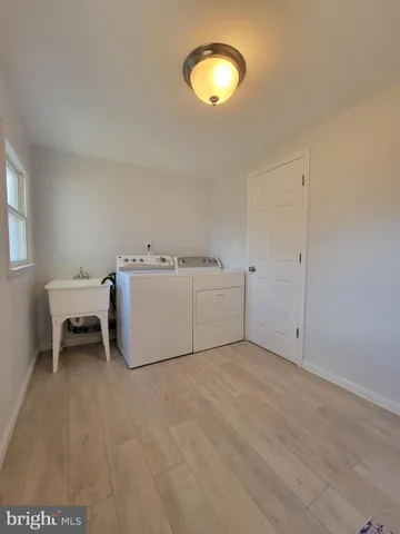 a view of a livingroom with a ceiling fan and window