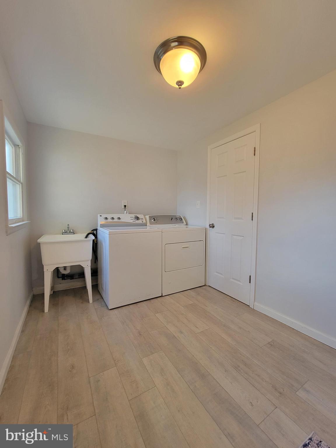 2621 North Snyder Avenue Sparrows Point, MD 21219 - Photo 24 of 65 a view of a room with a piano and wooden floor
