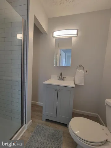 a kitchen with granite countertop a sink and steel appliances