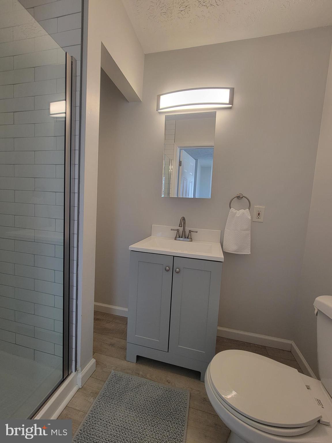 2621 North Snyder Avenue Sparrows Point, MD 21219 - Photo 35 of 65 a bathroom with a sink a toilet and mirror
