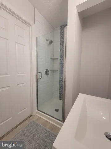 a view of a kitchen with microwave and cabinets