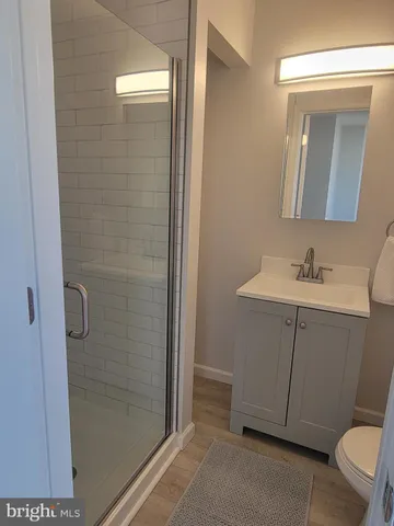 a kitchen with stainless steel appliances granite countertop a refrigerator and a stove