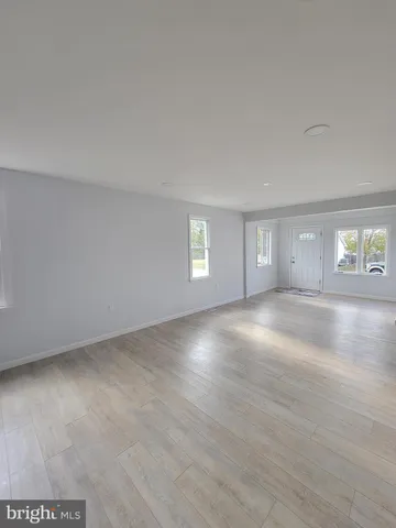 a kitchen with a sink stove top oven and cabinets