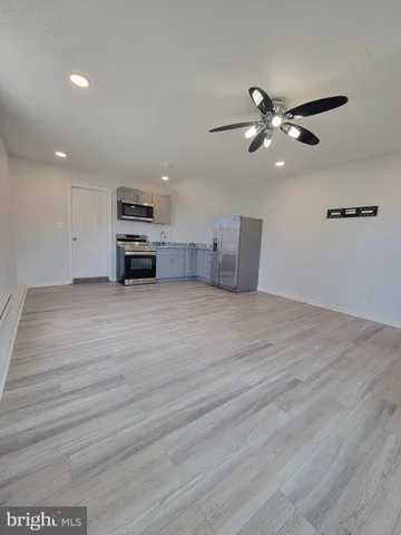 a bathroom with a shower a toilet and a sink