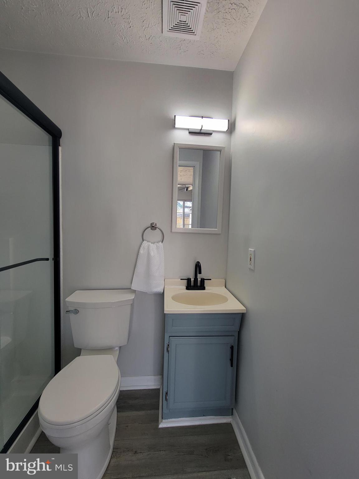 2621 North Snyder Avenue Sparrows Point, MD 21219 - Photo 47 of 65 a bathroom with a toilet sink and mirror