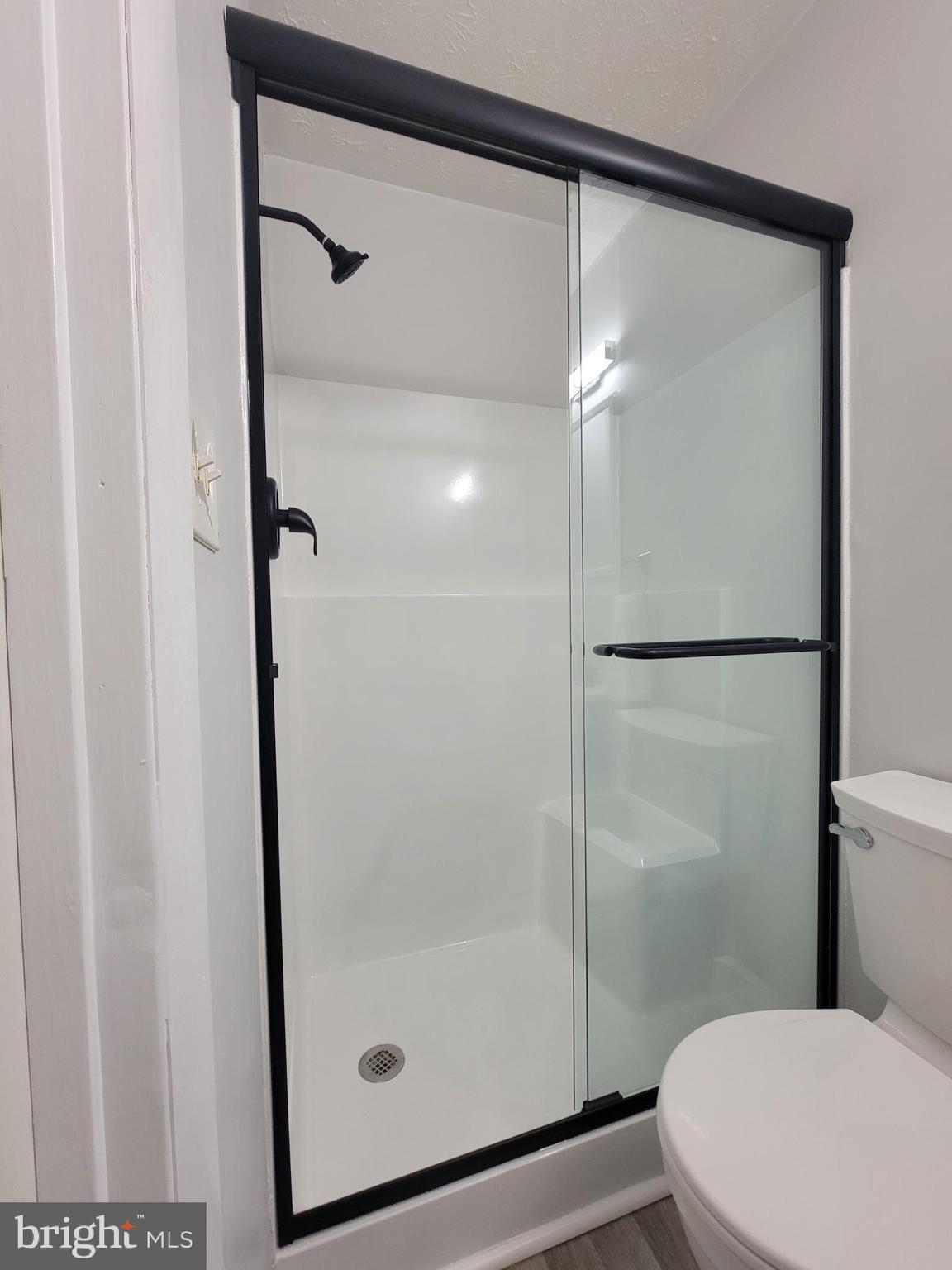 2621 North Snyder Avenue Sparrows Point, MD 21219 - Photo 49 of 65 a bathroom with a shower a toilet and a sink