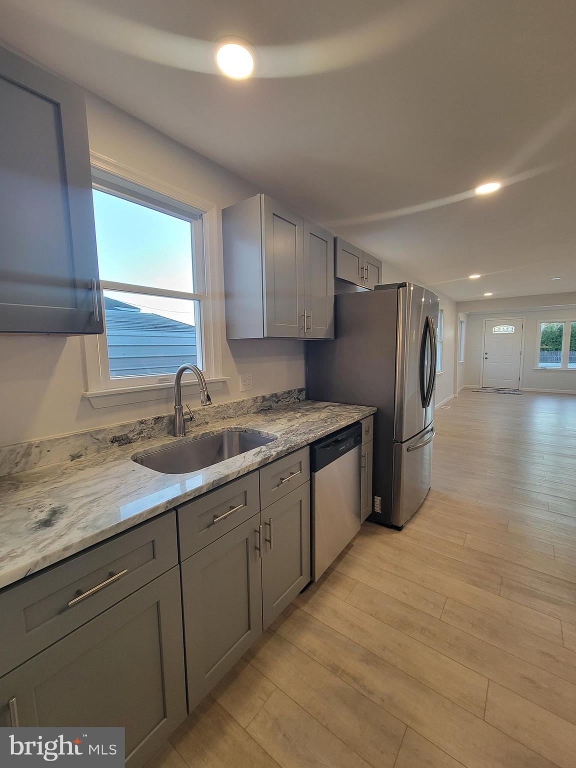 2621 North Snyder Avenue Sparrows Point, MD 21219 - Photo 6 of 65 a kitchen with stainless steel appliances granite countertop a sink a refrigerator and a stove