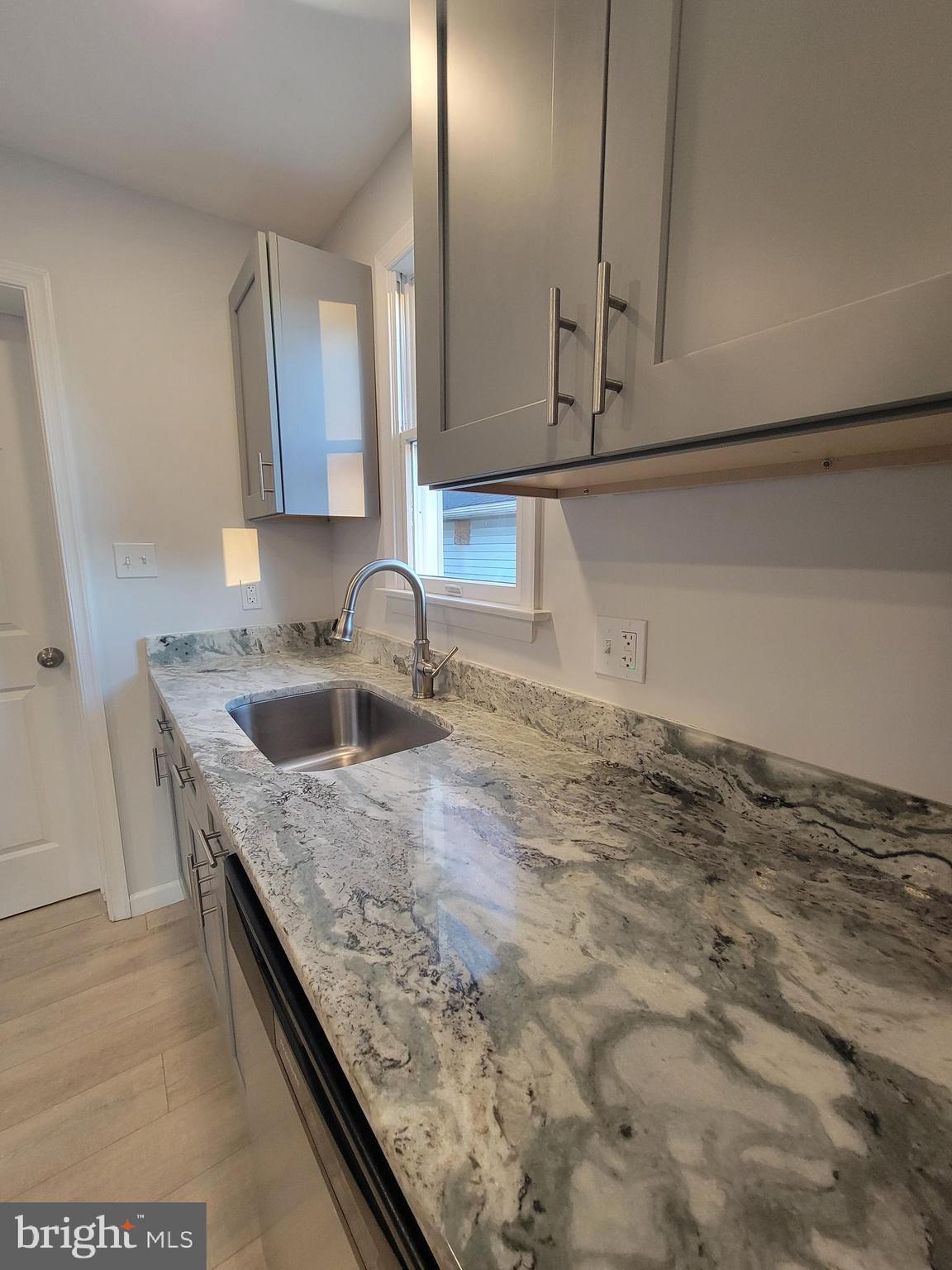 2621 North Snyder Avenue Sparrows Point, MD 21219 - Photo 10 of 65 a kitchen with a sink and cabinets