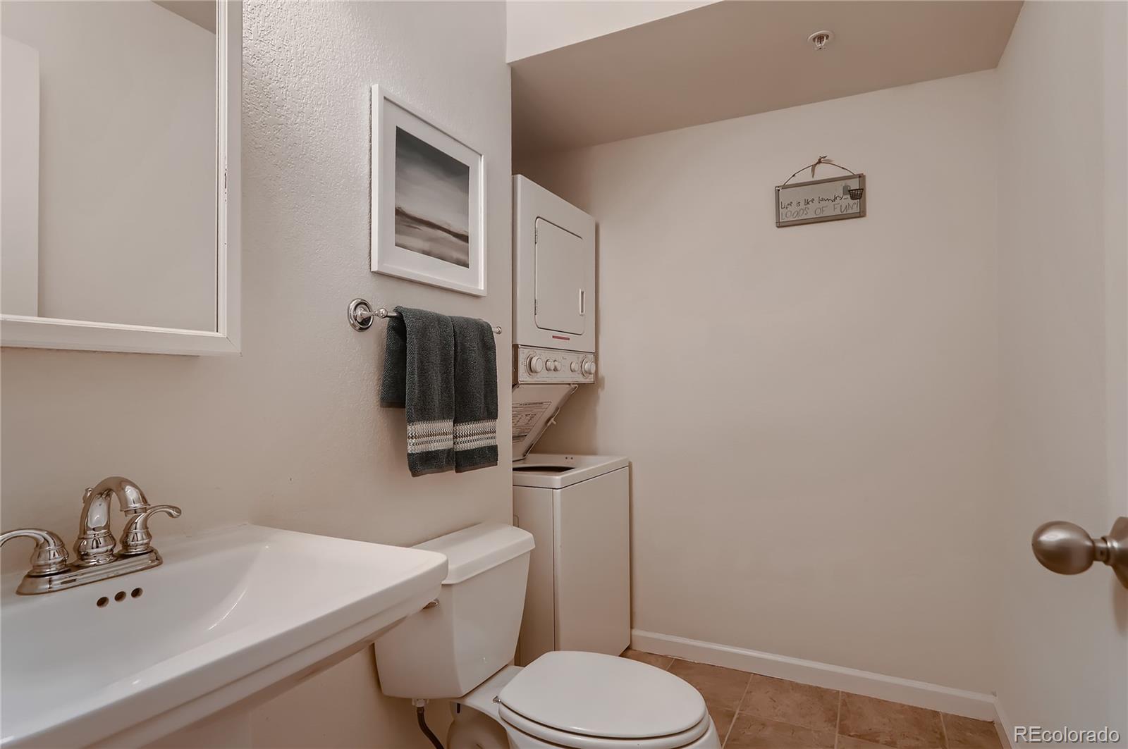 4640 15th Street, Unit D Boulder, CO 80304 - Photo 14 of 28 a bathroom with a sink a toilet and mirror