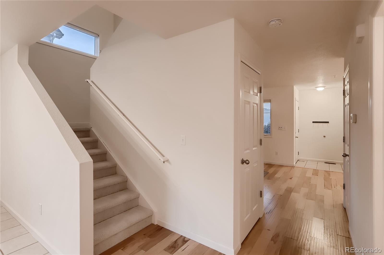 4640 15th Street, Unit D Boulder, CO 80304 - Photo 15 of 28 a view of a hallway with wooden floor and entryway