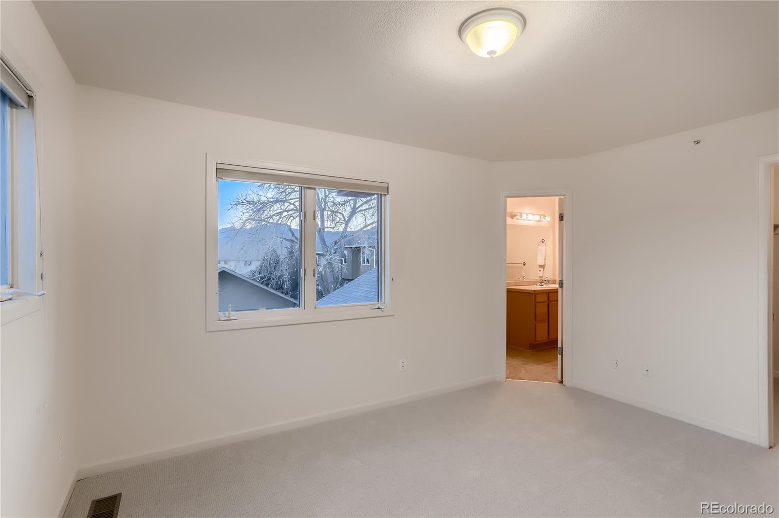 4640 15th Street, Unit D Boulder, CO 80304 - Photo 16 of 28 an empty room with windows and closet