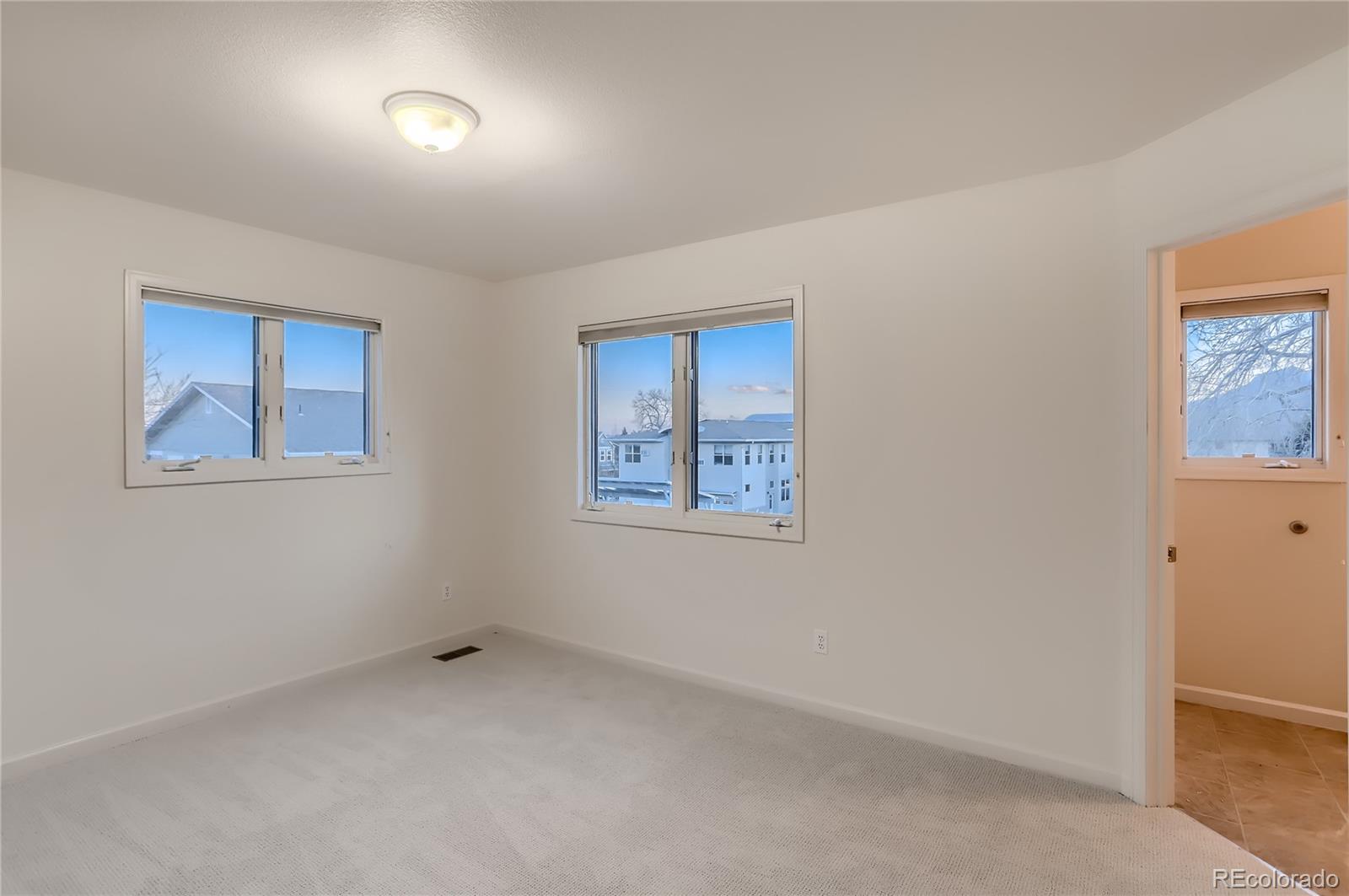 4640 15th Street, Unit D Boulder, CO 80304 - Photo 17 of 28 a view of an empty room with a window