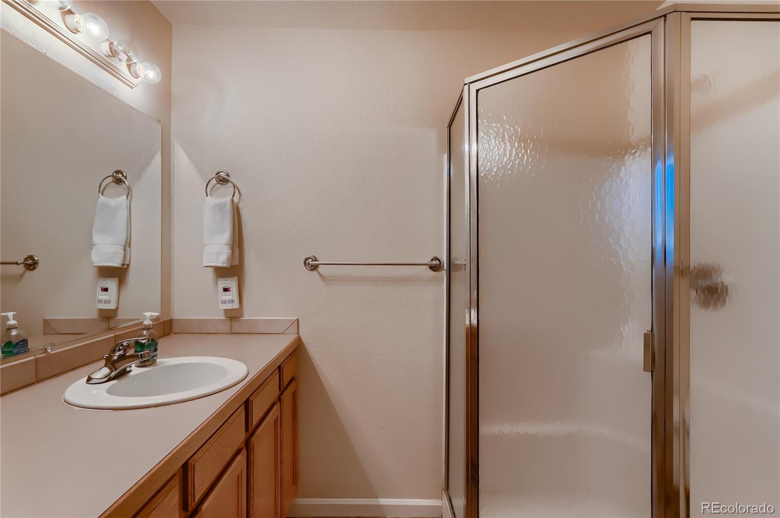 4640 15th Street, Unit D Boulder, CO 80304 - Photo 19 of 28 a bathroom with a sink and a mirror