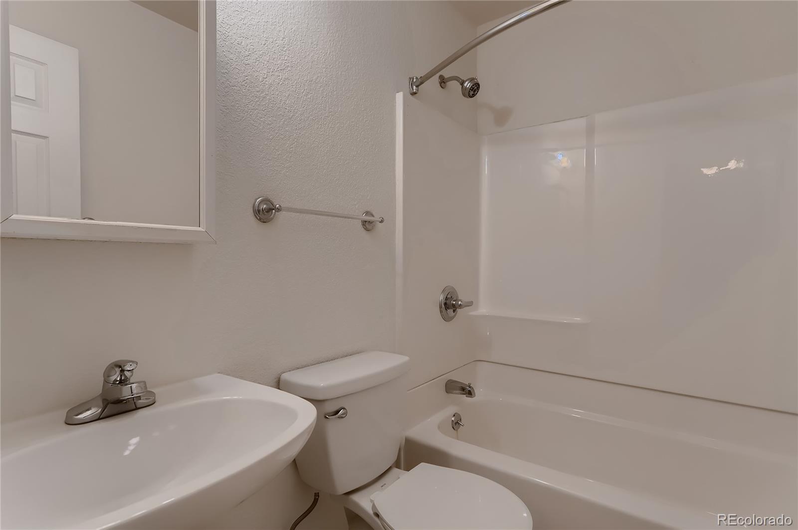4640 15th Street, Unit D Boulder, CO 80304 - Photo 23 of 28 a bathroom with a sink toilet and shower