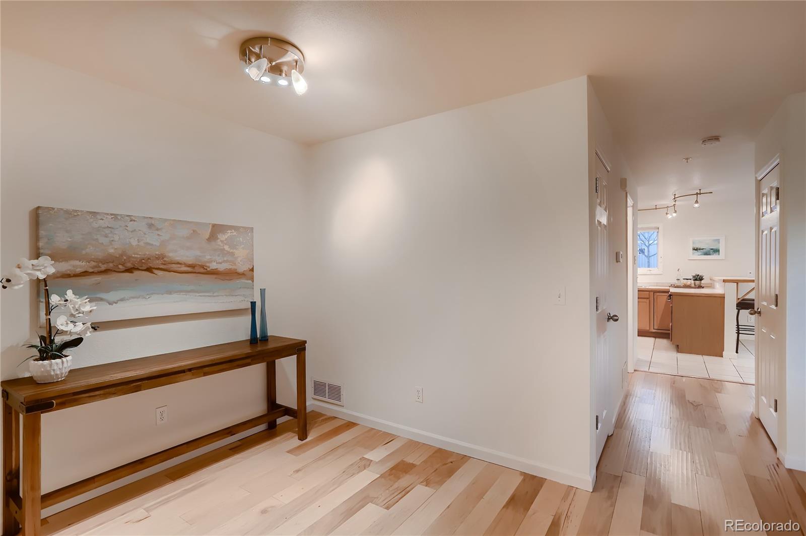 4640 15th Street, Unit D Boulder, CO 80304 - Photo 9 of 28 a view of a hallway with wooden floor and a bathroom