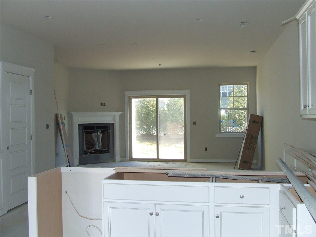 7916 Allscott Way Raleigh, NC 27612 - Photo 3 of 3 a living room with a sink furniture and a fireplace