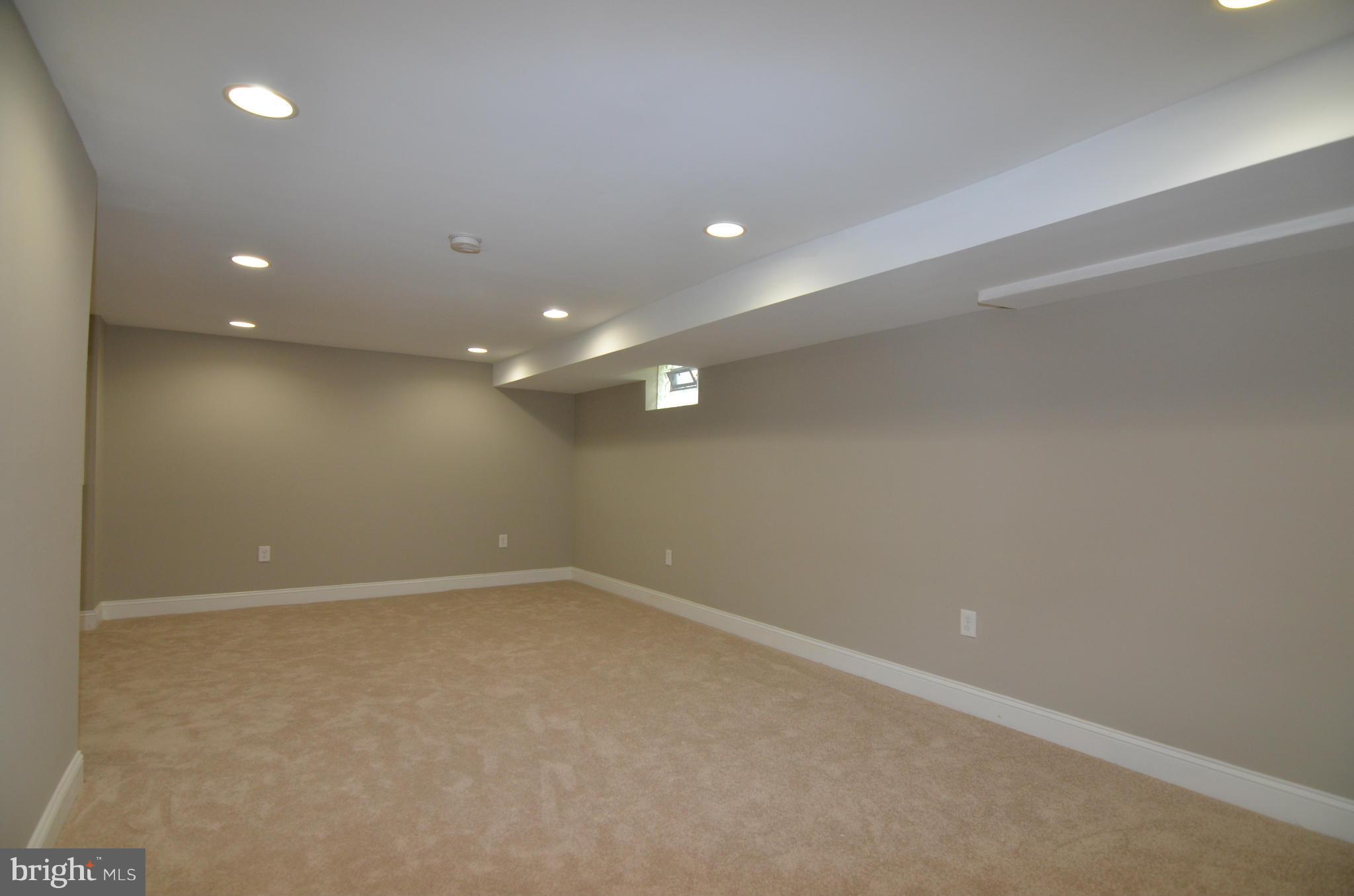 8254 Kavanagh Road Baltimore, MD 21222 - Photo 11 of 20 an empty room with a natural light