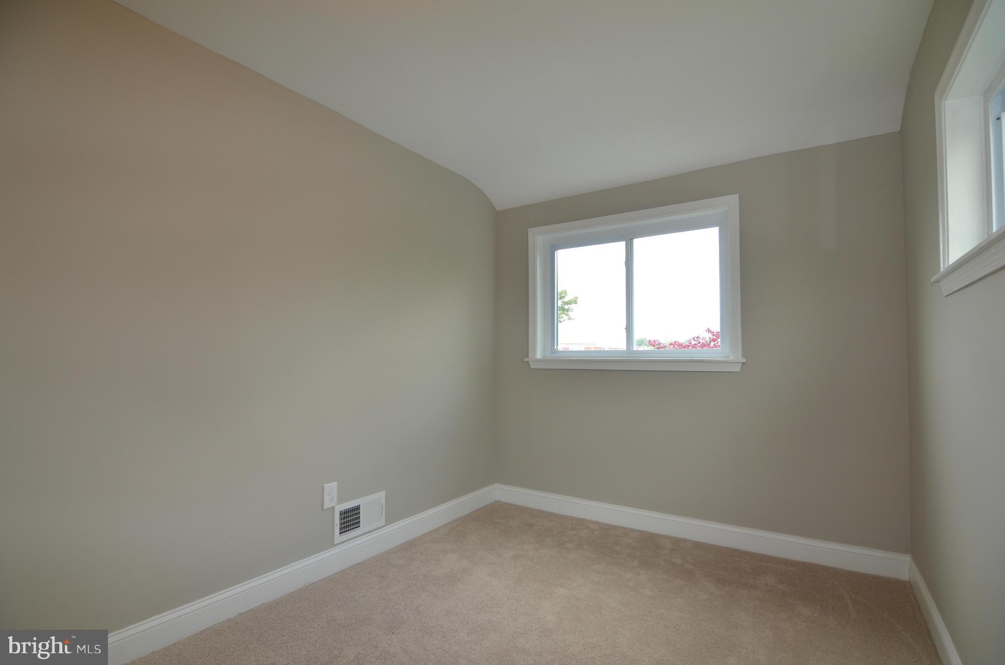 8254 Kavanagh Road Baltimore, MD 21222 - Photo 13 of 20 an empty room with a window