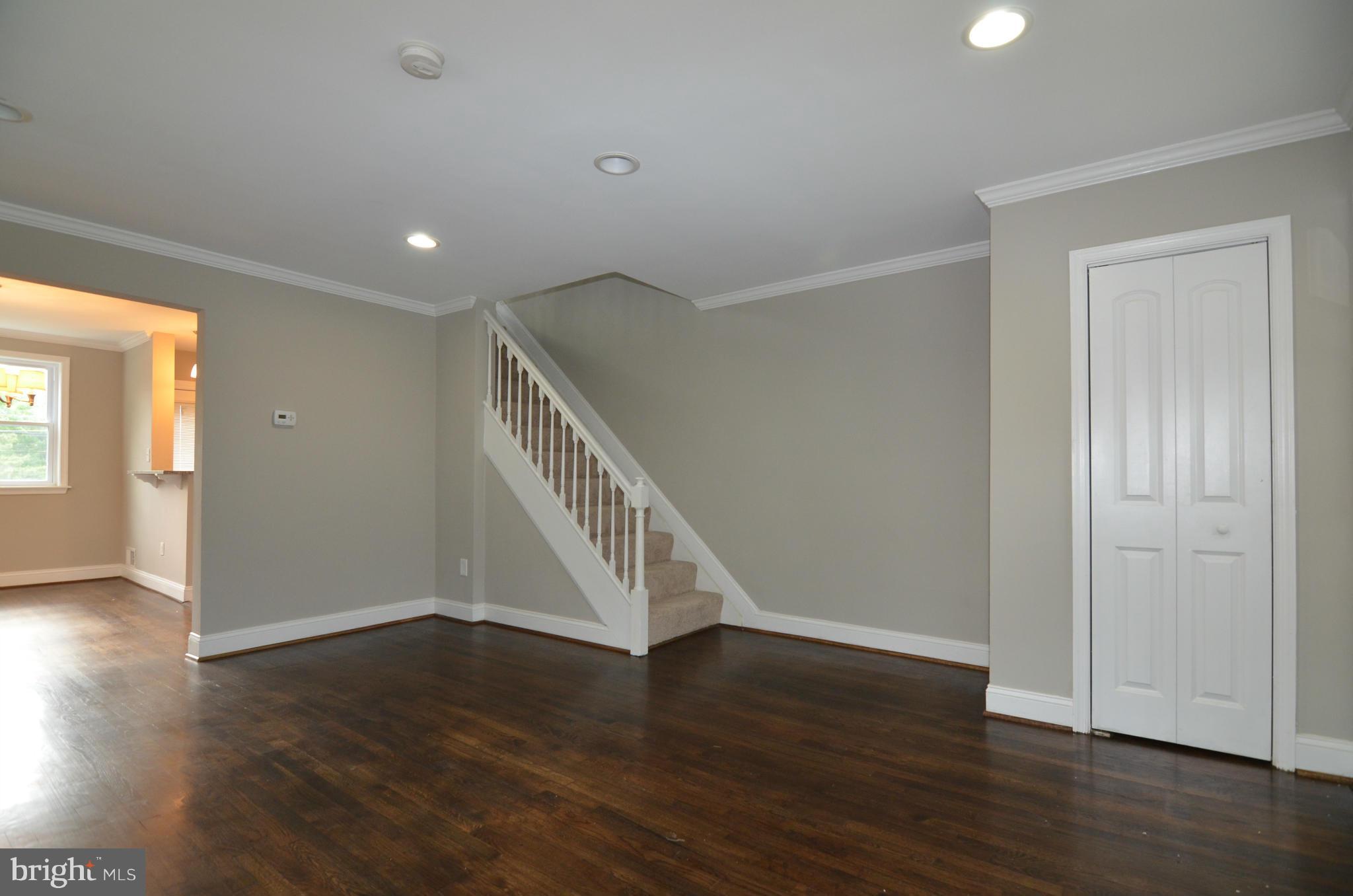 8254 Kavanagh Road Baltimore, MD 21222 - Photo 3 of 20 wooden floor in an empty room with a window