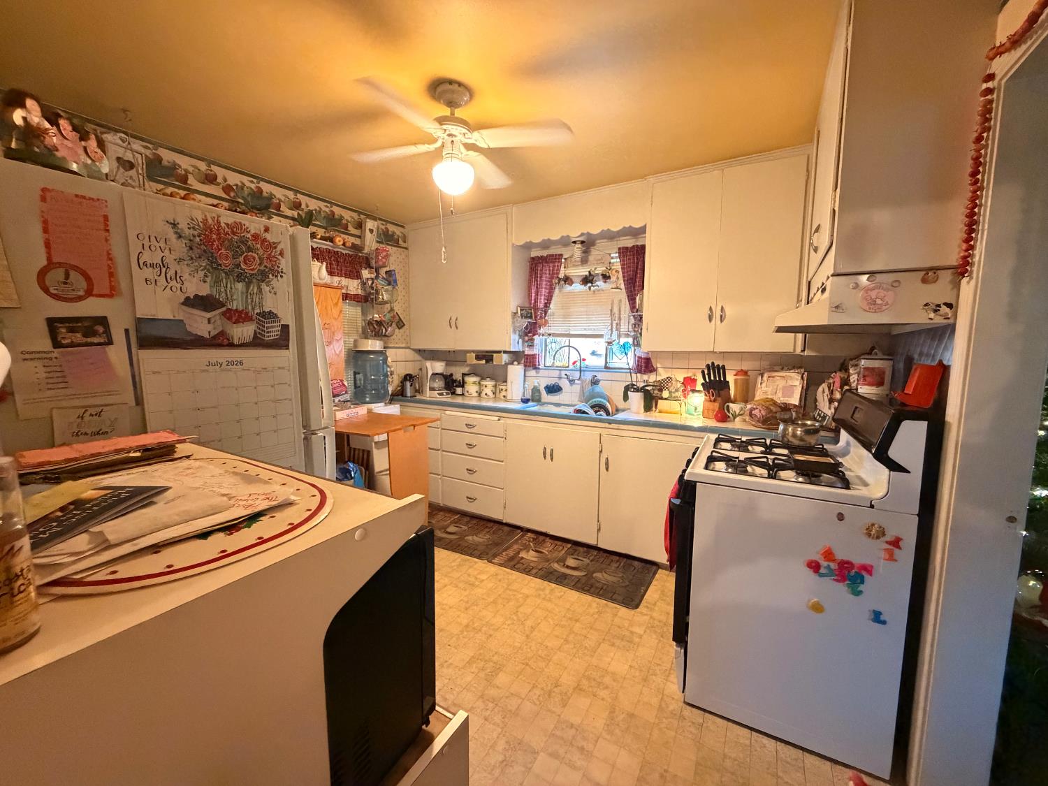 340 Bothun Road Turlock, CA 95380 - Photo 21 of 38 a kitchen with stainless steel appliances granite countertop a sink stove and refrigerator