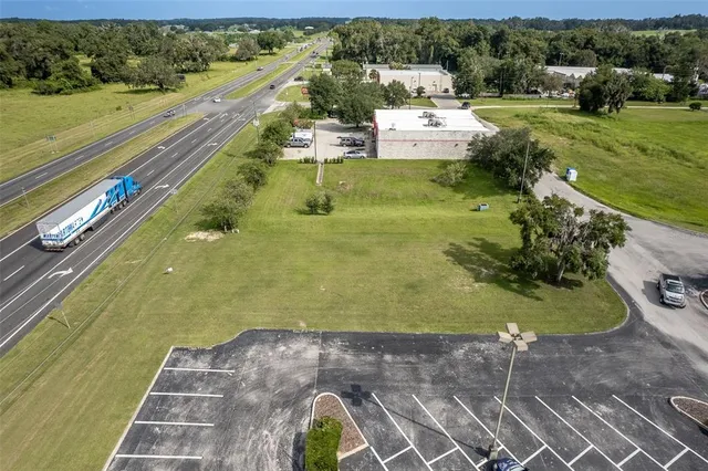 a view of a swimming pool with a yard