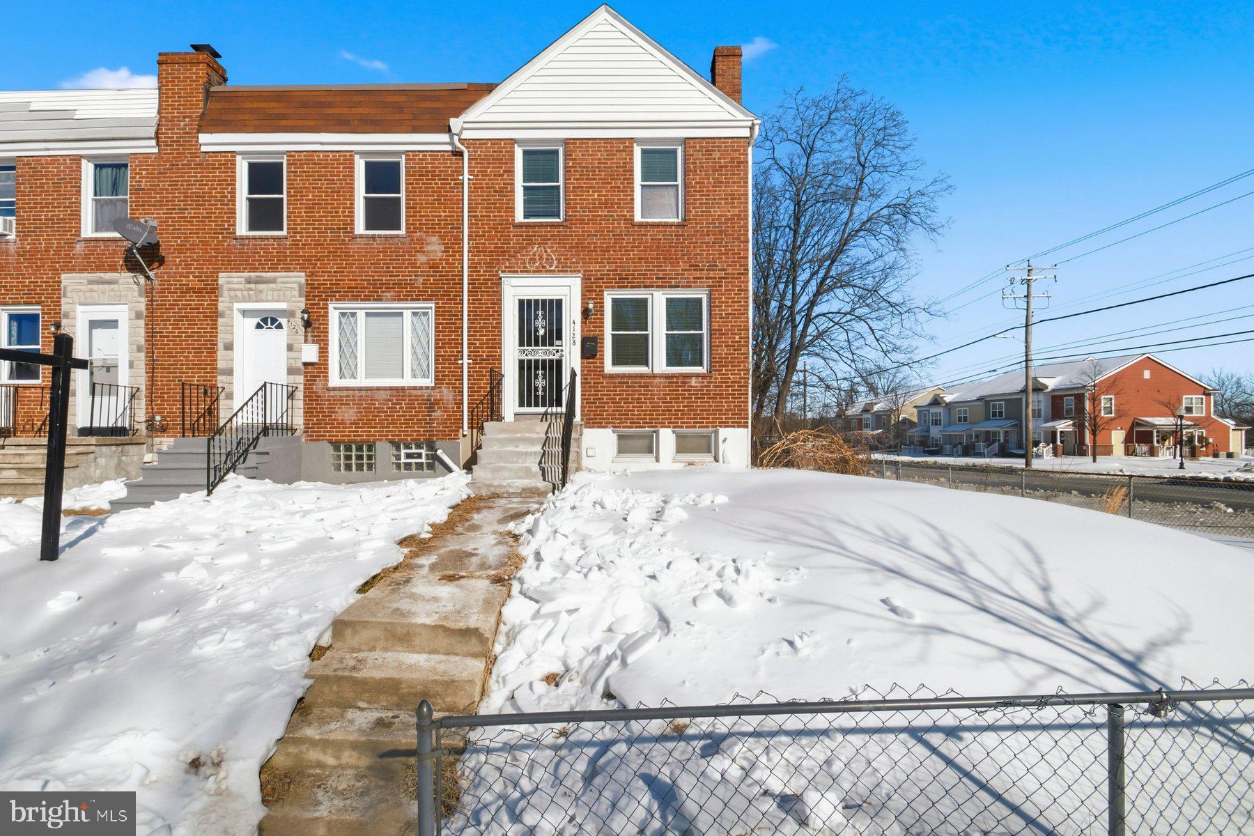 a view of a house with snow on the road