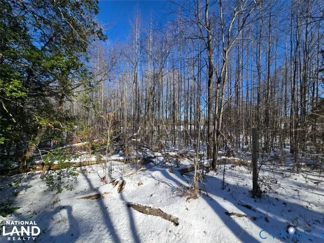 a view of outdoor space with wooden fence