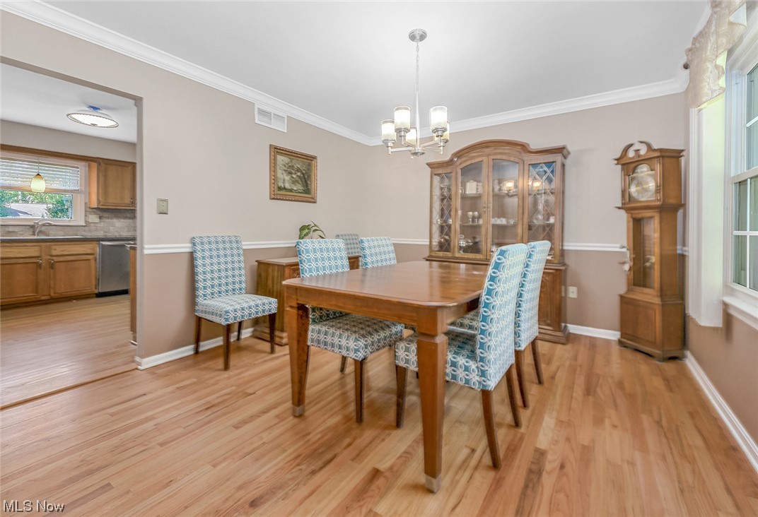 446 Stratford Road Akron, OH 44333 - Photo 5 of 29 Dining room with lots of natural light, crown molding, and hardwood flooring