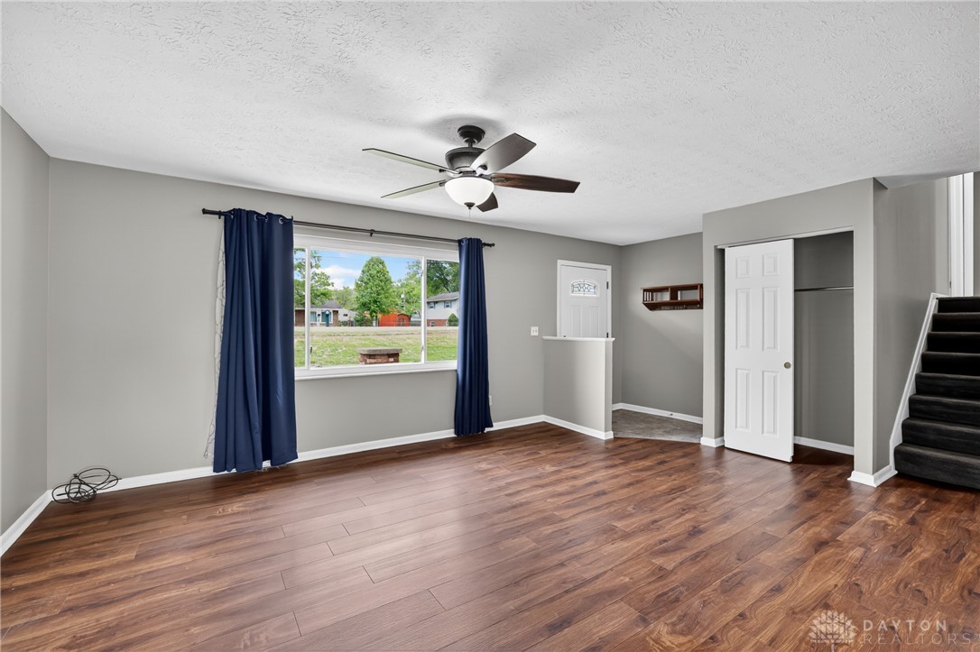 5741 Gray Road Fairfield, OH 45014 - Photo 5 of 32 This inviting living area features warm wood flooring and a refreshing ceiling fan, perfect for any season.