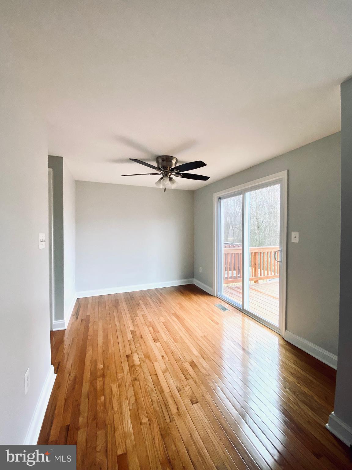 7266 Procopio Circle Columbia, MD 21046 - Photo 12 of 18 an empty room with wooden floor closet and windows