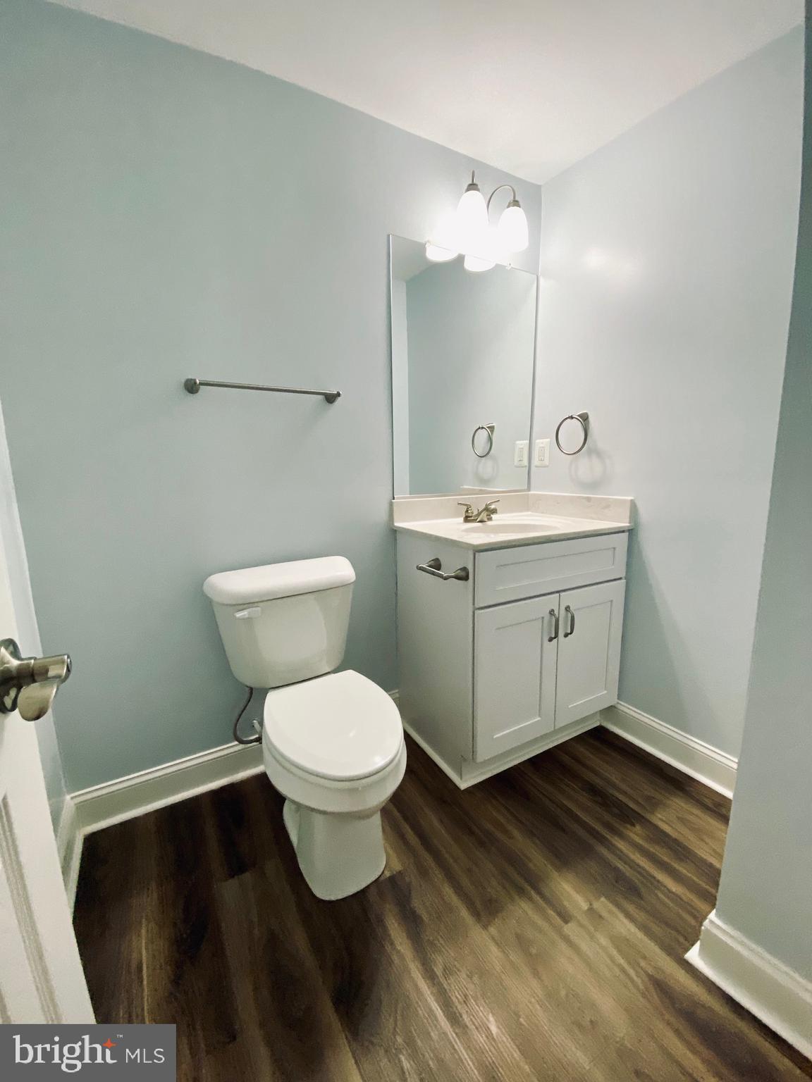 7266 Procopio Circle Columbia, MD 21046 - Photo 15 of 18 a bathroom with a toilet sink and mirror