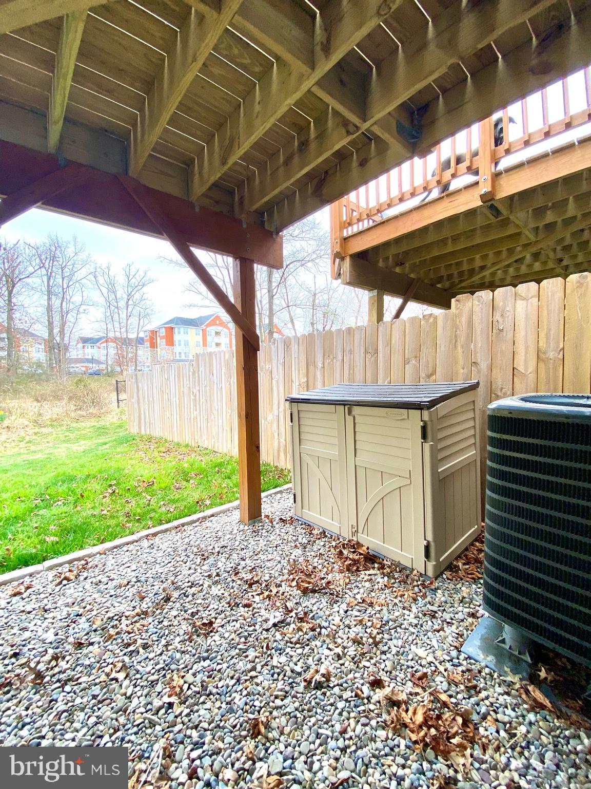 7266 Procopio Circle Columbia, MD 21046 - Photo 18 of 18 a backyard of a house with a garden and barbeque oven