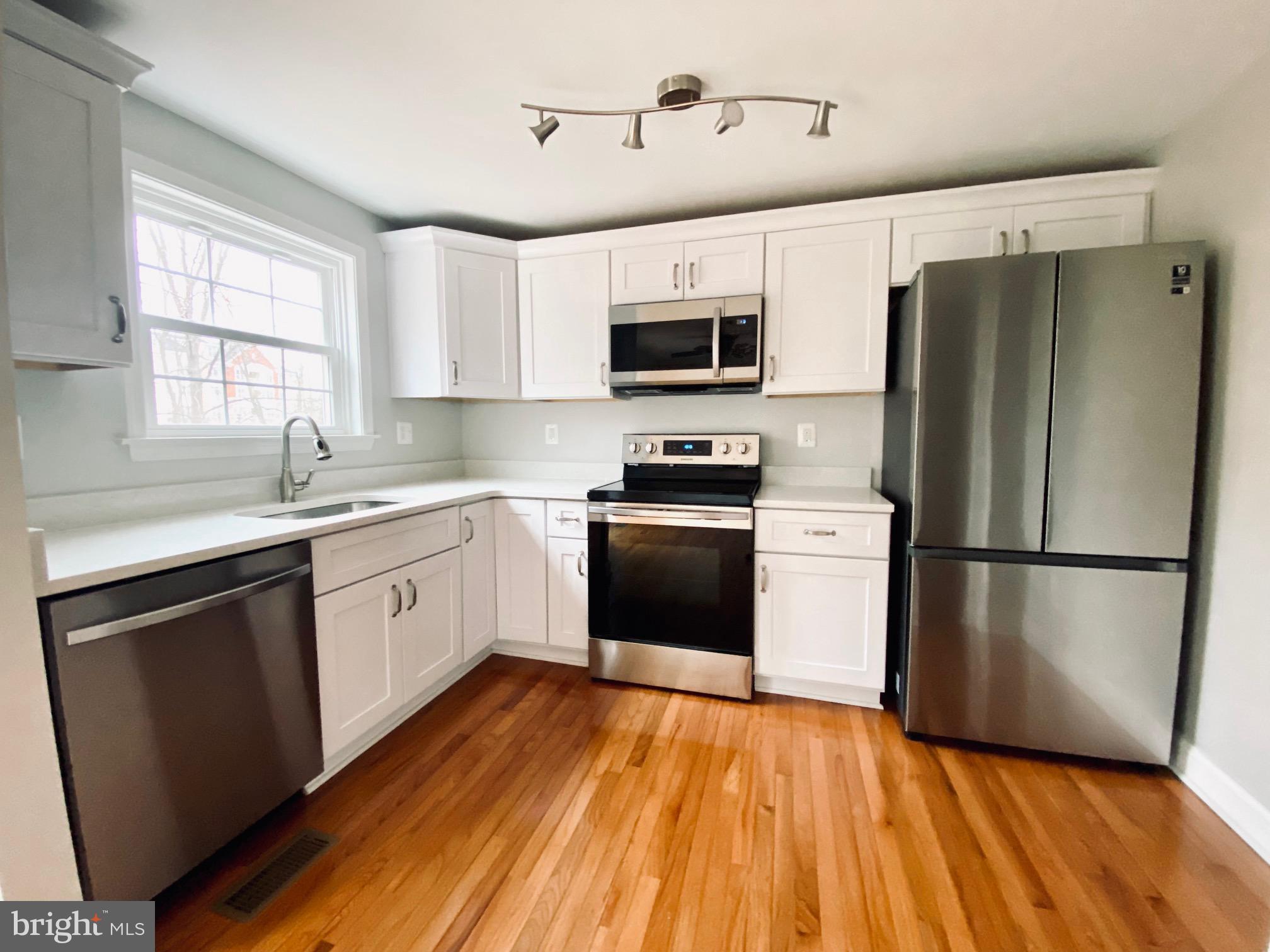 7266 Procopio Circle Columbia, MD 21046 - Photo 3 of 18 a kitchen with stainless steel appliances a refrigerator sink and microwave