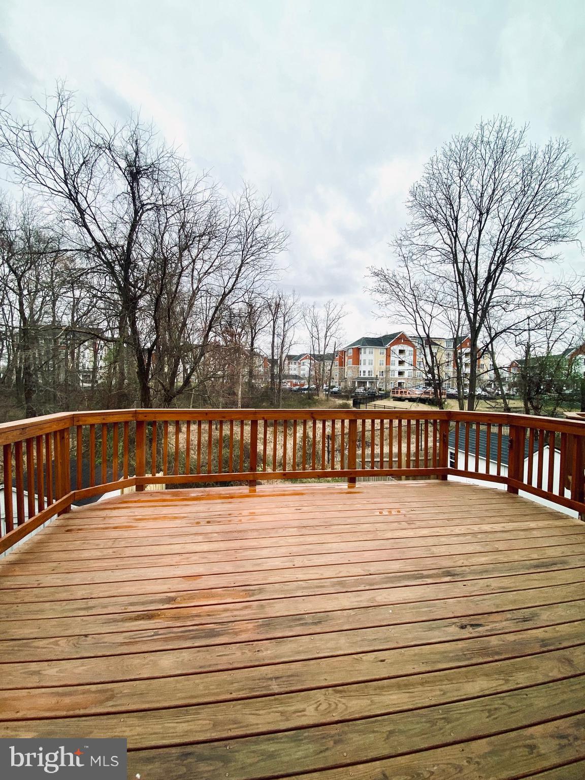 7266 Procopio Circle Columbia, MD 21046 - Photo 5 of 18 a view of deck with swimming pool and trees