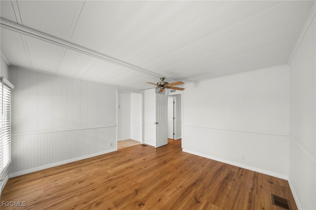 2971 York Road St. James City, FL 33956 - Photo 14 of 23 a view of empty room with wooden floor