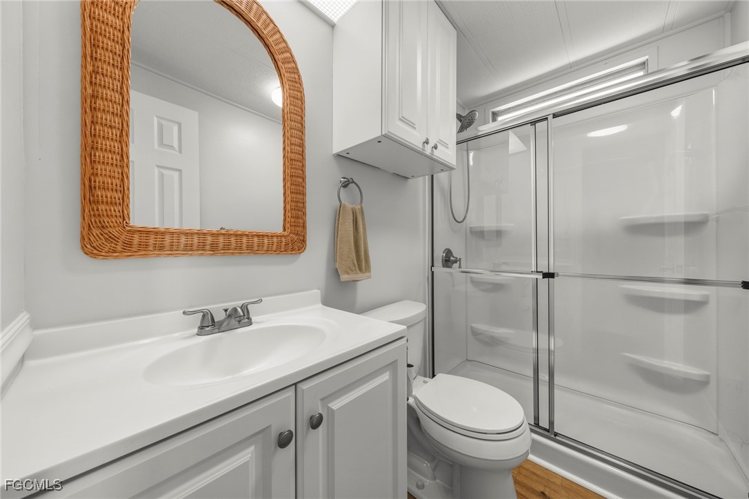 2971 York Road St. James City, FL 33956 - Photo 16 of 23 a bathroom with a sink toilet and shower