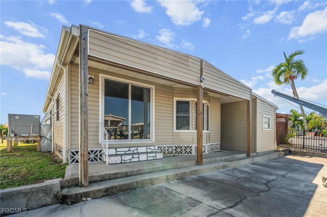 2971 York Road St. James City, FL 33956 - Photo 19 of 23 a front view of a house with a garage