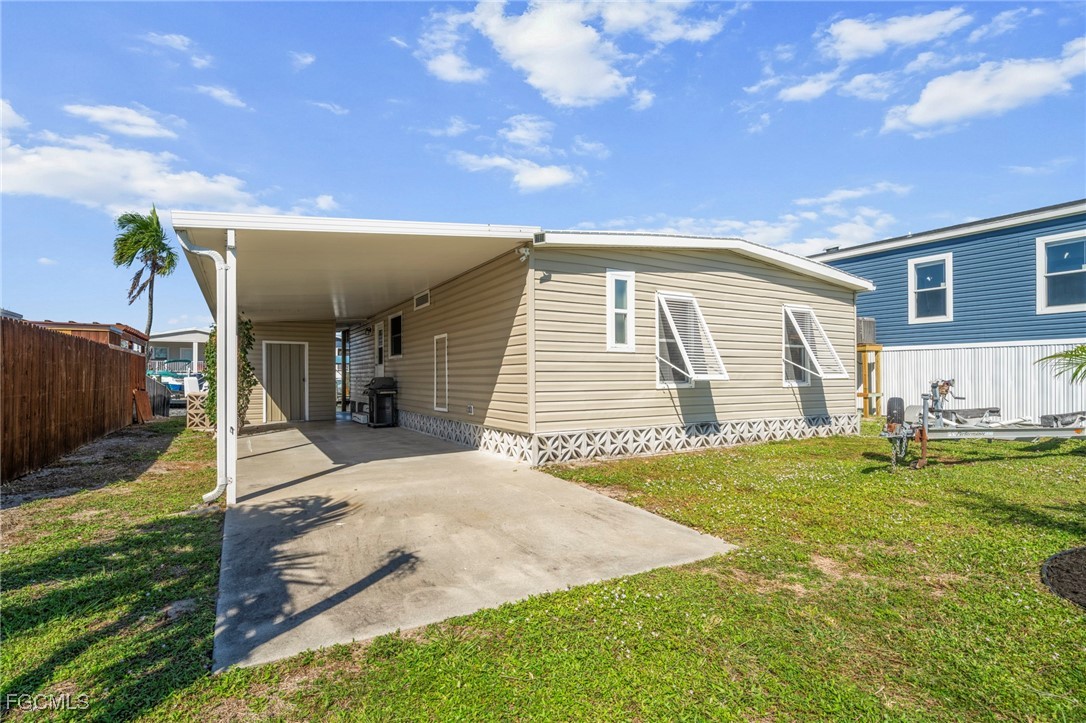 2971 York Road St. James City, FL 33956 - Photo 2 of 23 a view of a house with backyard and sitting area